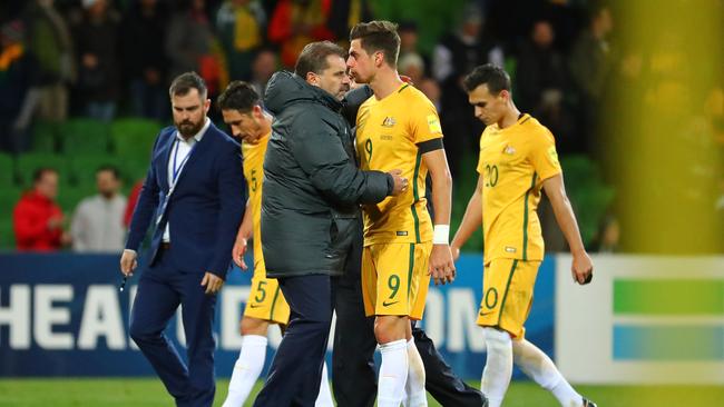 Ange Postecoglou embraces Tomi Juric after the 2-1 qualifying win against Thailand at AAMI Park. Photo: Getty Images