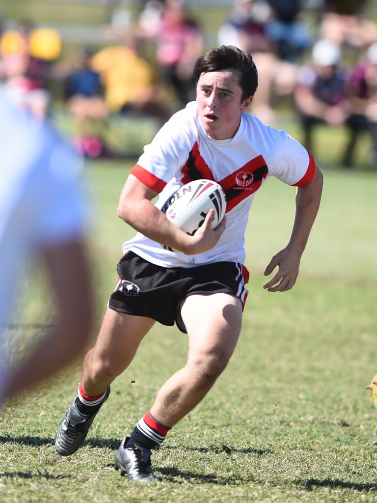 Boys Rugby League State Championship held at Northern Division, Brothers Leagues ground, Townsville. South West (black) v Wide Bay (white). 16-18 years. Ezekiel Monckton of Shalom College.