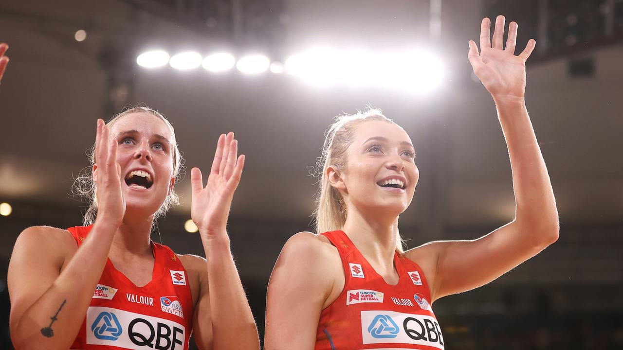 SYDNEY, AUSTRALIA - JUNE 12: Maddy Turner and Helen Housby of the Swifts wave to the crowd as they celebrates victory during the round 14 Super Netball match between NSW Swifts and Queensland Firebirds at Ken Rosewall Arena, on June 12, 2022, in Sydney, Australia. (Photo by Mark Kolbe/Getty Images)