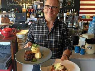 WINTER MENU: Fratellini's owner Andrew Powell with two dishes from the new winter menu. Picture: Michele Sternberg