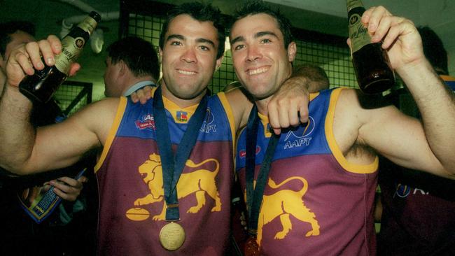 Chris and Brad after winning the 2002 Grand Final. Picture: Colleen Petch