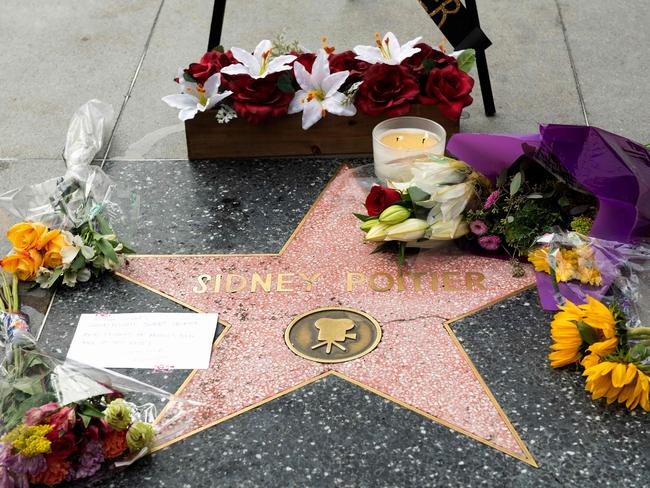 A note and flowers are seen on Sidney Poitier's star on the Hollywood Walk of Fame. Picture: AFP