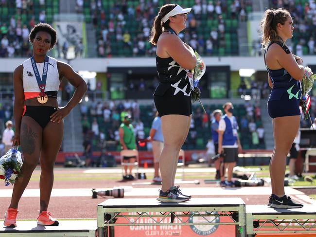 Bronze medallist Gwendolyn Berry (left), turns away from US flag during the national anthem after the women's hammer throw final at the US Olympic Trials. (Photo by Patrick Smith/Getty Images)