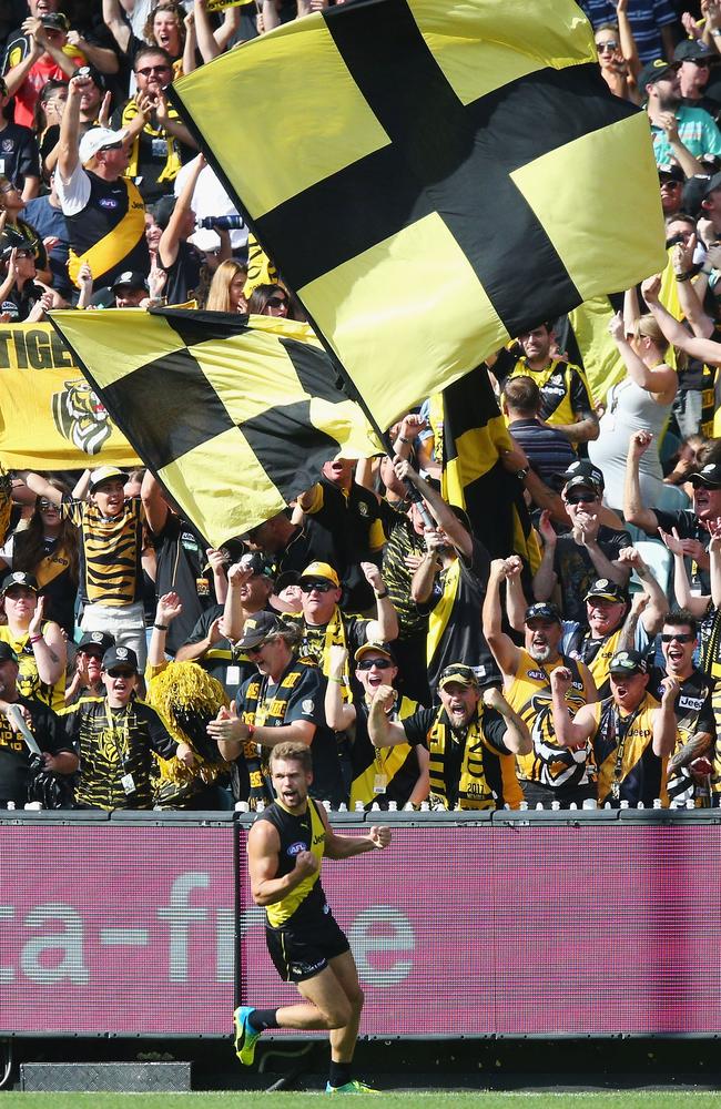 The Richmond cheersquad celebrates a goal with Dan Butler.