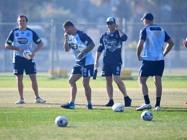 NSW Blues head coach Brad Fittler (centre) laughs as he stands with his players before the training session. Picture: AAP Image/David Moir