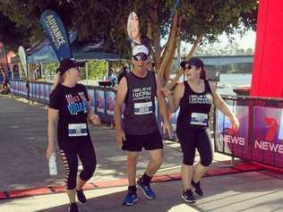 AMAZING FEAT: Trevor Heyes is all smiles after completing the 5km walk at the 7 Rocky River Run with Melissa Mackay (left) and Andrea Mcintosh by his side. Picture: Contributed ROK030719heyes1