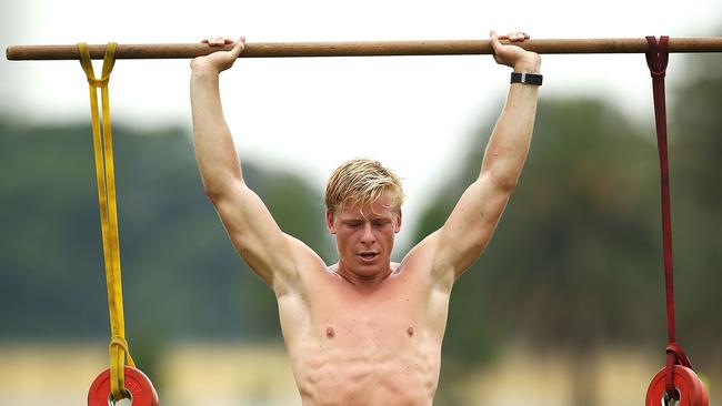 Isaac Heeney performs strength drills during a Sydney Swans AFL pre-season training session.