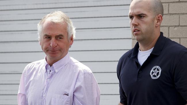 Paul Douglas Peters is escorted from the Federal Courthouse in Louisville, Kentucky, after his arrest over the fake collar bomb attack on Sydney teen Madeleine Pulver. Picture: AP