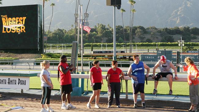 The contestants workout at a racetrack.