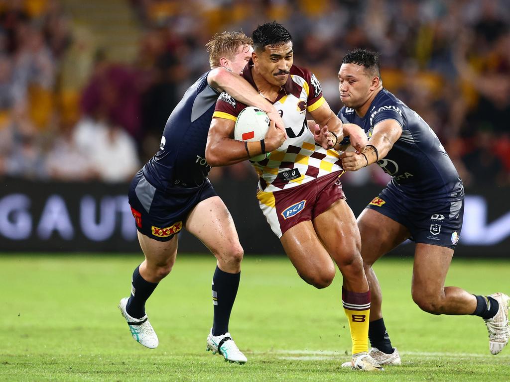 Deine Mariner of the Broncos is tackled by Tom Dearden. Photo: Chris Hyde/Getty Images