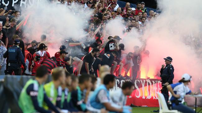 Wanderer fans let off flares during the round 18 A-League match between Melbourne Victory and Western Sydney Wanderers at Etihad Stadium in Melbourne, on Saturday, Feb. 6, 2016. (AAP Image/David Crosling) NO ARCHIVING, EDITORIAL USE ONLY