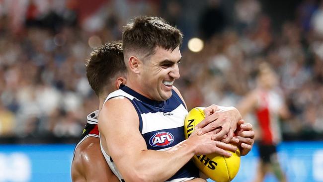 GEELONG, AUSTRALIA - MARCH 16: Shaun Mannagh of the Cats is tackled by Jack Steele of the Saints during the 2024 AFL Round 01 match between the Geelong Cats and the St Kilda Saints at GMHBA Stadium on March 16, 2024 in Geelong, Australia. (Photo by Michael Willson/AFL Photos via Getty Images)