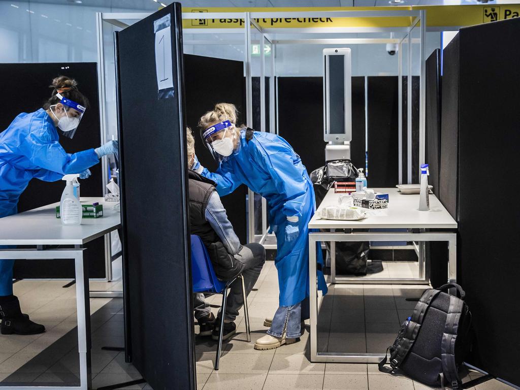 Travellers from South Africa are tested for the coronavirus on arrival at Schiphol Airport. Picture: AFP