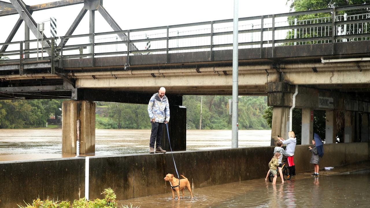 Heavy rain continues to batter the NSW mid north coast causing major flooding. Kempsey residents check the water levels at the towns levy wall . Nathan Edwards