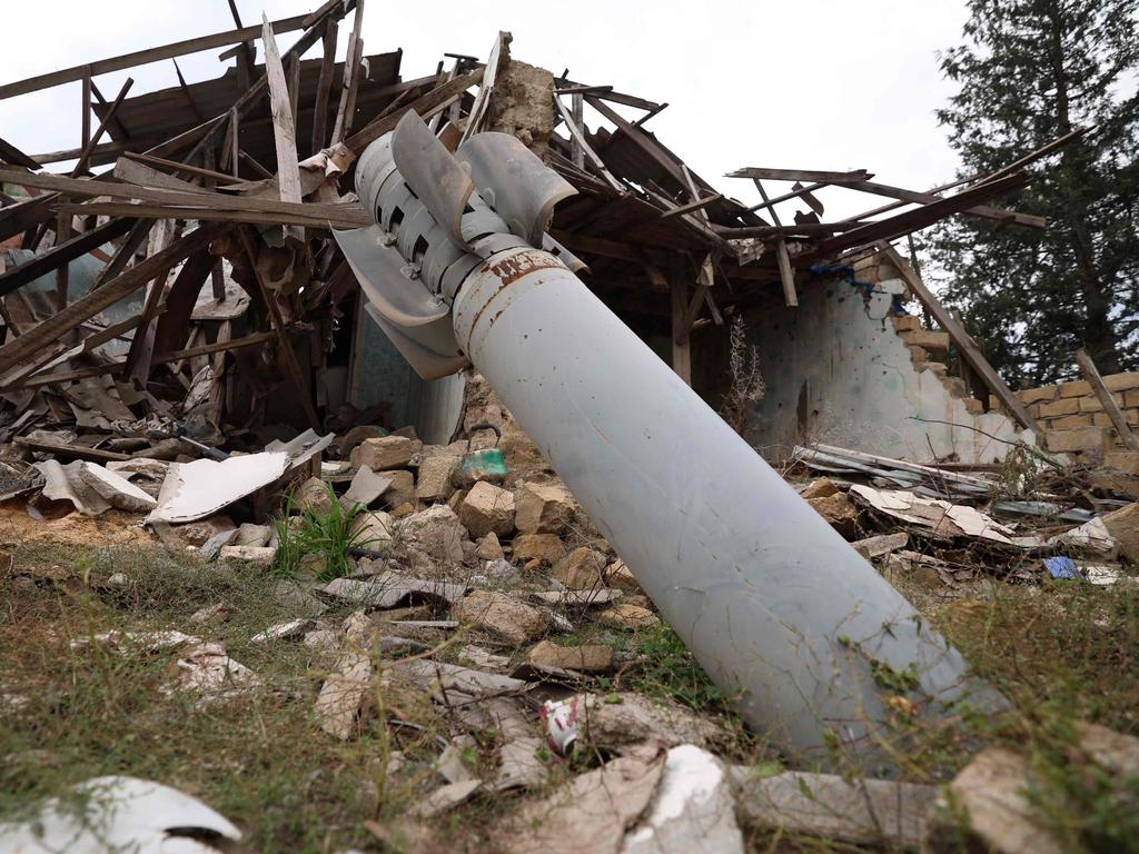 This photo shows a missile in the ground next to a house destroyed during the 2020 war between Azerbaijan and Armenian separatists, in the town of Terter, on September 24, 2023. Picture: AFP