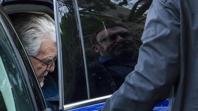 Rolf Harris arrives at his home being protected by men in plain clothes, in Maidenhead, UK, after being released on bail from prison. Picture: Ben Stevens / i-Images