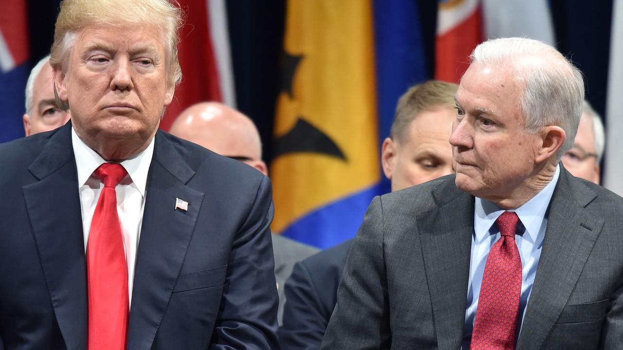 Mr Trump with his first attorney-general, Jeff Sessions. Picture: Nicholas Kamm/AFP