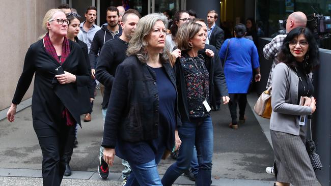 Staff leave the Ultimo headquarters in Sydney. Picture: John Feder.