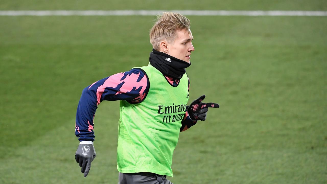 Real Madrid midfielder Martin Odegaard is a wanted man (Photo by OSCAR DEL POZO / AFP)