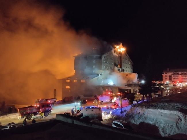 A fire broke out on the fourth floor of the hotel in Bolu's Kartalkaya ski resort. Picture: DHA