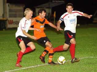 Buderim’s Robbie McDonald runs the ball past Caloundra’s Matthew Cornthwaite, left, and Ray Schultz. Picture: Cade Mooney