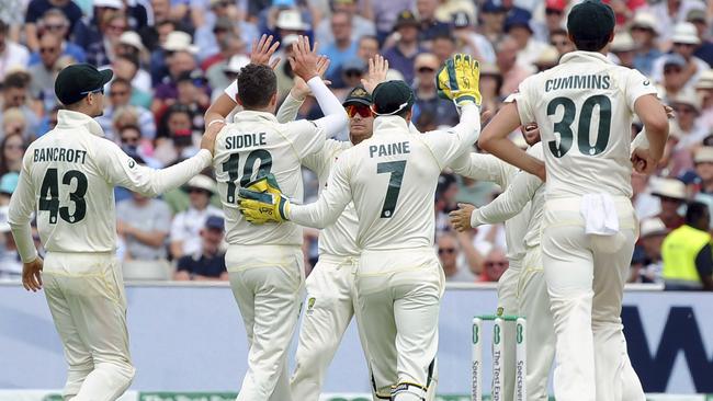 Peter Siddle celebrates with team-mates after dismissing Jonny Bairstow. Picture: AP