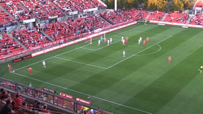 Adelaide United's Jordan Elsey throws bottles into crowd