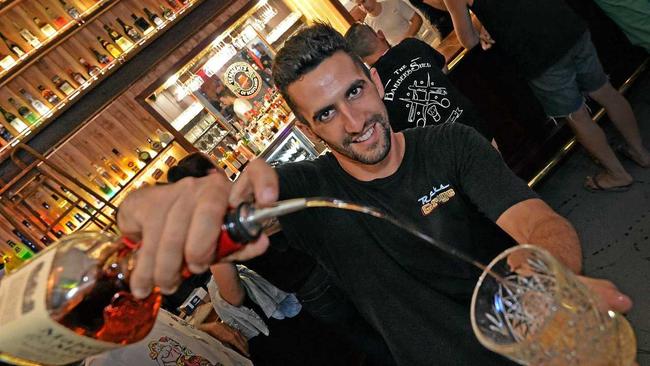 JUST IN TIME: Rick’s Diner manager Ben Jamieson pours a shot at the Palmwoods establishment’s American whiskey bar which opened on Friday, on the eve of the Time Warp Festival. Picture: Patrick Woods