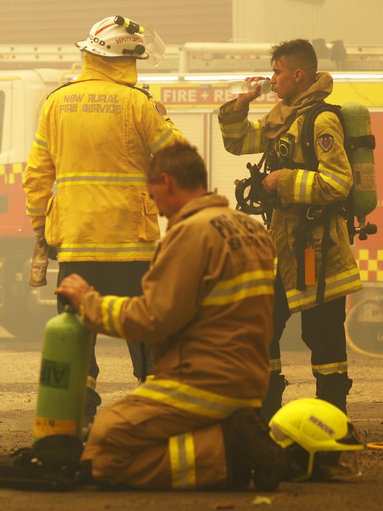 Exhausted firefighters taking a quick break after battling the fire front in Balmoral. Picture: Sam Ruttyn