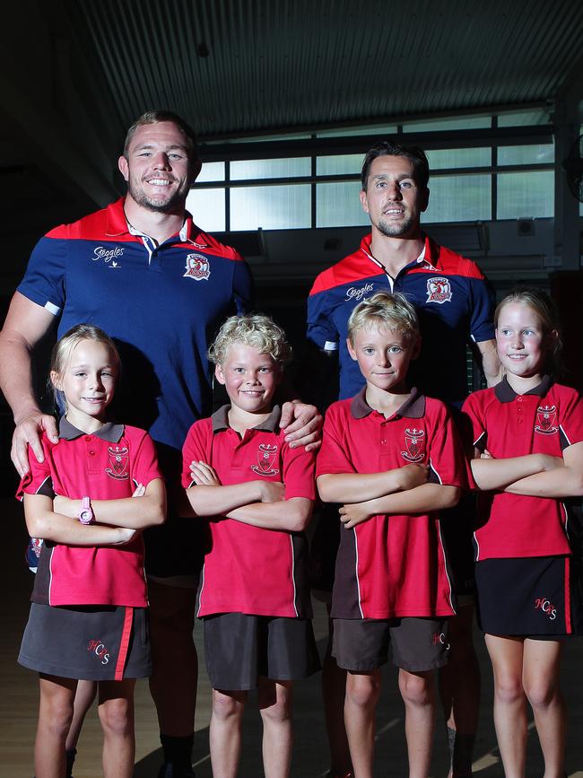 Olivia Doble, Nick Anderson, Jake Walker, Olivia Gabril, with Roosters players Mitchell Pearce and Martin Kennedy at Holy Cross Catholic Primary School in Bondi Junction. Picture: Carly Earl.