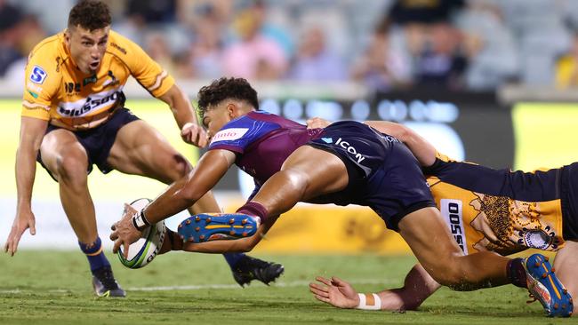 The Reds’ Jordan Petaia scores in the dying moments of the clash with the Brumbies