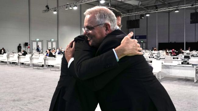 Scott Morrison is hugged by Dutch Prime Minister Mark Rutte in Glasgow on Tuesday. Picture: Adam Taylor