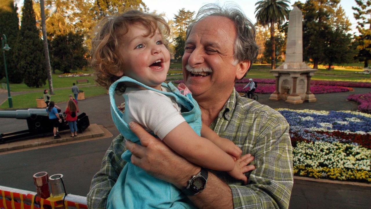 Courtney (2yrs) with her Granfather Carlo Martinelli, from Sydney at Queens Park in Toowoomba at Carnival of Flowers time. Pic: David Martinelli.