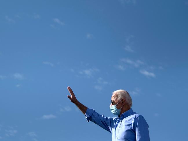 Joe Biden waves as he arrives to speak at a drive-in rally in Las Vegas. Picture: AFP.