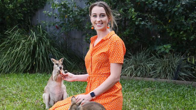 Founder of The Agile Project Shai Ager caring for six agile wallabies, including Dasher, Enzo and Clarice. PICTURE: BRENDAN RADKE