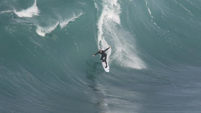 Australian big wave surfer Dylan Longbottom and the wipeout that put him in hospital at a South Australian reef break. Picture: Andrew Brooks