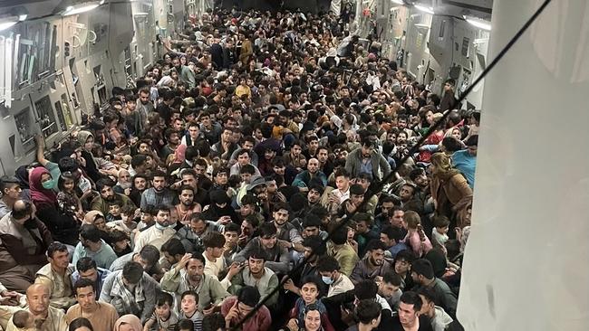 More than 600 Afghans cram inside a US Air Force C-17 Globemaster III, which flew from Kabul to Qatar on August 15, 2021, to escape the hard line Islamist rule expected under the Taliban. Picture: AFP