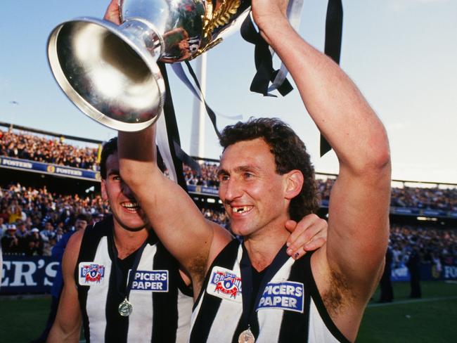 Footballer Peter Daicos of the Magpies celebrates winning the 1990 Grand Final.