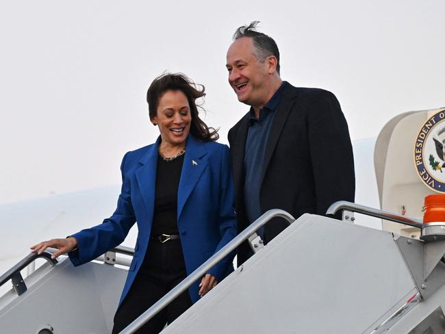 Kamala Harris and husband Doug Emhoff step off Air Force Two upon arrival at Chicago O’Hare International Airport. Picture: AFP