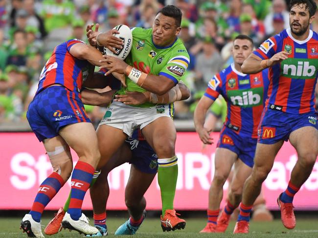 Josh Papalii of the Raiders is tackled.