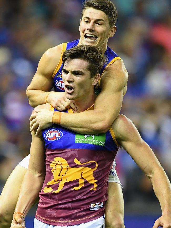 Ben Keays celebrates a goal with former Lions teammate Dayne Zorko. Picture: QUINN ROONEY (Getty Images).