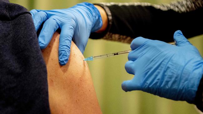 Dr Ayre says vaccination is still the key to keeping people out of hospital. Picture: AFP