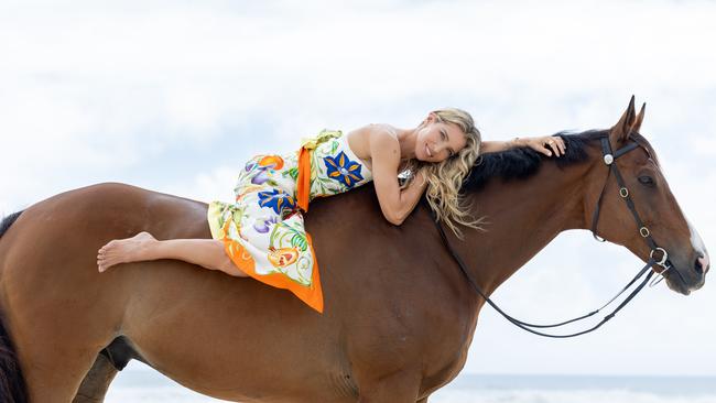 Elsa Pataky. Picture: Luke Marsden Elsa’s looks - Silk blue Scanlan Theodore Green floral Scanlan Theodore Alemais 2 piece floral silk set Bvlgari jewels throughout Stylist: Kimberly Gardner (Magic Millions Head Stylist) Photography: Luke Marsden Hair: Brad Mullins Makeup: Linda Jefferyes Horse: retired racehorse and now a competitive Off the Track showjumper, Bruce. His racing name was ‘One Inch Punch’