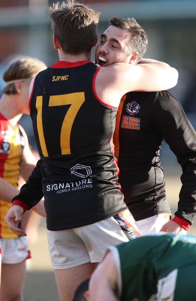 Callum Mitchell and Luke Webb celebrate a St Joseph’s victory. Picture: Mark Wilson