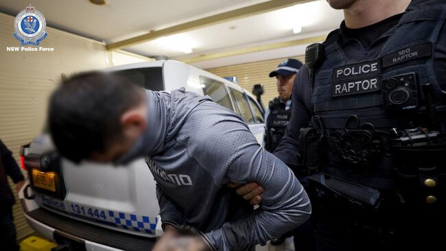 Horne pictured after arriving in NSW following his extradition from the Northern Territory. Picture: NSW Police