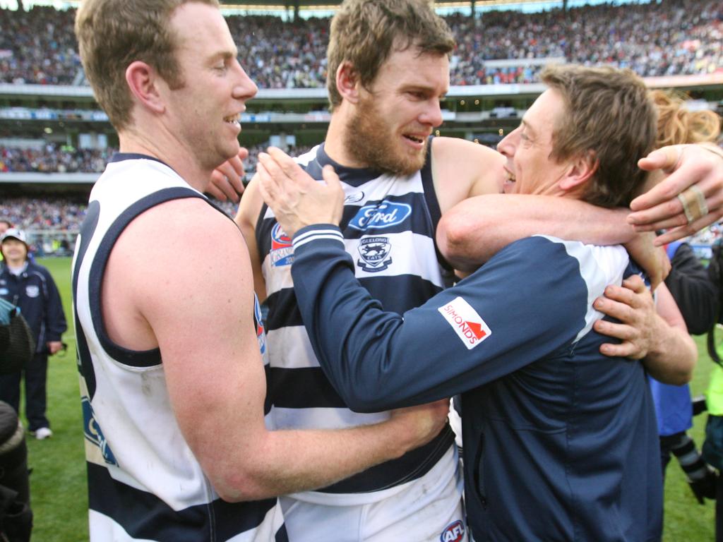 Steve Johnson and Cameron Mooney celebrate Geelong’s 2009 Grand Final win with Mark Thompson.