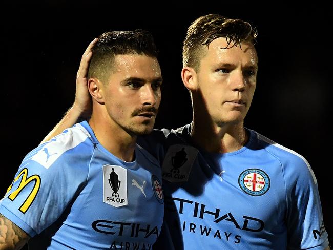 Jamie Maclaren of Melbourne City (left) is congratulated by teammate Scott Galloway after scoring a goal during the FFA Cup semi-final match between the Brisbane Strikers and Melbourne City FC at Perry Park in Brisbane, Tuesday, October 1, 2019. (AAP Image/Dan Peled) NO ARCHIVING, EDITORIAL USE ONLY