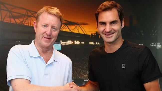 British tennis writer Mike Dickson, with Roger Federer, has died in Melbourne at the age of 59. Picture: Supplied