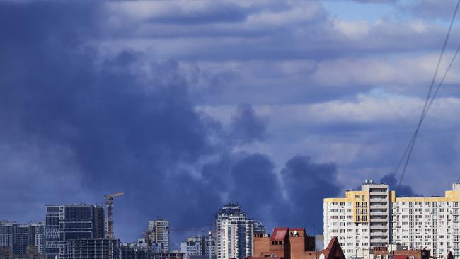 Smoke rises from behind buildings following bombings in Kyiv, Ukraine, on Sunday. Picture: Getty Images