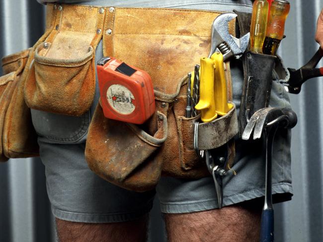 UNDATED : Generic pic of a Builder wearing his utility belt - work tools tape measure